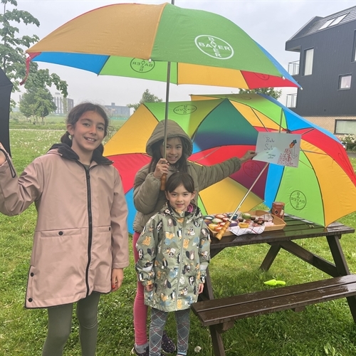 Students brave the weather during Charity Week at the Junior School